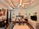 Main bedroom features tray ceilings, ceiling fan, and ensuite bathroom at 150 Willow Shoals Dr, Covington, GA 30016