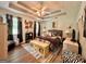 This main bedroom features a ceiling fan and a window with custom curtains at 150 Willow Shoals Dr, Covington, GA 30016