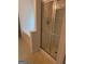 Bathroom featuring a glass-door shower with a shower head and faucet, next to a bathtub and patterned flooring at 1925 Cedar Walk Ln, Conley, GA 30288