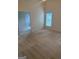 Spacious bedroom featuring neutral carpet, vaulted ceilings, and natural light from a window at 1925 Cedar Walk Ln, Conley, GA 30288