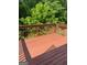 Exterior wooden deck space overlooking the lush, green yard at 1925 Cedar Walk Ln, Conley, GA 30288