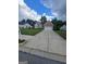Traditional-style home with a well-manicured lawn and an extended concrete driveway at 1925 Cedar Walk Ln, Conley, GA 30288