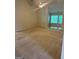 Spacious living room featuring vaulted ceilings, neutral colors, and carpet at 1925 Cedar Walk Ln, Conley, GA 30288
