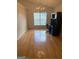 Bright office space with hardwood floors, chandelier, and a large window at 1925 Cedar Walk Ln, Conley, GA 30288