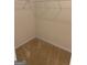 Bright walk-in closet with shelving, offering ample storage space, and featuring neutral carpeting at 1925 Cedar Walk Ln, Conley, GA 30288