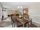 Open concept dining room flowing into the living room and kitchen, creating a spacious and connected living space at 7813 Newbury Dr, Jonesboro, GA 30236