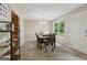 Inviting dining room featuring a wooden table, six chairs, and a modern chandelier for comfortable Gathering meals at 7813 Newbury Dr, Jonesboro, GA 30236
