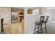 Functional kitchen with stainless steel appliances, wooden cabinetry, and bar seating, perfect for casual dining at 7813 Newbury Dr, Jonesboro, GA 30236