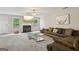 Spacious living room with plush carpeting, a fireplace, and a large comfortable sofa, perfect for relaxing or entertaining at 7813 Newbury Dr, Jonesboro, GA 30236