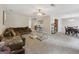 Expansive living room with plush carpeting, comfortable seating, and an open layout, ideal for hosting gatherings at 7813 Newbury Dr, Jonesboro, GA 30236