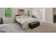Bright main bedroom featuring natural light and neutral tones to inspire relaxation at 7813 Newbury Dr, Jonesboro, GA 30236