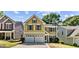 Charming two-story home with an attached two car garage, and complementary landscaping at 984 Wenham Ln, Lawrenceville, GA 30044