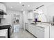 Modern kitchen with white cabinetry, subway tile backsplash, and stainless steel appliances at 984 Wenham Ln, Lawrenceville, GA 30044