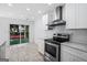 Modern kitchen with stainless steel appliances, white countertops, and backyard access at 984 Wenham Ln, Lawrenceville, GA 30044