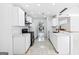 Modern kitchen with white cabinetry, subway tile backsplash, and stainless steel appliances at 984 Wenham Ln, Lawrenceville, GA 30044