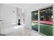 Bright open living room with tile floors, fireplace and backyard access at 984 Wenham Ln, Lawrenceville, GA 30044