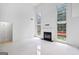 Open living space showcases tall windows, fireplace, and access to the entry hallway at 984 Wenham Ln, Lawrenceville, GA 30044