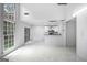 Bright living room with sliding glass doors, adjacent to an open kitchen at 984 Wenham Ln, Lawrenceville, GA 30044