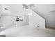 Open-concept living room with white marble flooring and open access to the kitchen and stairway at 984 Wenham Ln, Lawrenceville, GA 30044