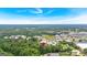 An aerial view captures a residential neighborhood near commercial area and green spaces at 30 Mary Ella Dr, Carrollton, GA 30116