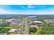 An aerial view features a commercial area with nearby roadways and lush greenery, offering urban convenience at 30 Mary Ella Dr, Carrollton, GA 30116