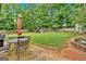 This backyard features a patio, lawn, a playset, and a fenced-in yard at 30 Mary Ella Dr, Carrollton, GA 30116