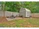 The well-kept backyard includes a shed, perfect for storage and outdoor hobbies at 30 Mary Ella Dr, Carrollton, GA 30116