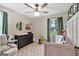 Charming bedroom with decor, window, and light-colored carpet at 30 Mary Ella Dr, Carrollton, GA 30116