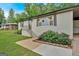 Charming, renovated brick ranch with lovely flower boxes and mature landscaping at 30 Mary Ella Dr, Carrollton, GA 30116