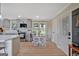 This is a bright kitchen with gray cabinets, stainless steel appliances, and a breakfast nook with natural light at 30 Mary Ella Dr, Carrollton, GA 30116