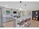 Updated kitchen with white countertops, modern appliances, and center island with seating at 30 Mary Ella Dr, Carrollton, GA 30116
