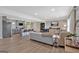 Spacious living room featuring modern decor, hardwood floors, and abundant natural light with an open kitchen at 30 Mary Ella Dr, Carrollton, GA 30116