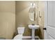 Half bathroom with pedestal sink and mirror at 108 Donovan Ave, Locust Grove, GA 30248