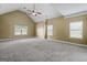 A bright, airy bedroom with high ceilings, neutral tones, plush carpeting, and lots of natural light at 108 Donovan Ave, Locust Grove, GA 30248