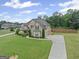 Beautiful two-story home featuring a long driveway and a spacious, well-maintained lawn at 108 Donovan Ave, Locust Grove, GA 30248