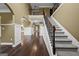 Grand foyer with high ceilings, hardwood floors, and an elegant staircase at 108 Donovan Ave, Locust Grove, GA 30248