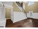 Spacious foyer featuring hardwood floors, white wainscoting, and a staircase at 108 Donovan Ave, Locust Grove, GA 30248