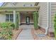 Welcoming front porch with neatly trimmed shrubbery and a well-maintained walkway at 108 Donovan Ave, Locust Grove, GA 30248