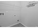 Clean laundry room with white wire shelving at 108 Donovan Ave, Locust Grove, GA 30248