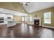 Spacious living room featuring an open kitchen, fireplace, and lots of natural light at 108 Donovan Ave, Locust Grove, GA 30248