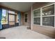 Screened porch featuring concrete flooring and sliding glass doors at 108 Donovan Ave, Locust Grove, GA 30248