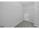 A clean, empty walk-in closet with wire shelving and carpeting at 108 Donovan Ave, Locust Grove, GA 30248