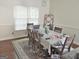 Bright dining room featuring wood floors, a large window and a table with seating for six at 3332 Glenrose Trl, Chamblee, GA 30341