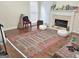 Cozy living room with a fireplace and hardwood floors at 3332 Glenrose Trl, Chamblee, GA 30341