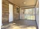Covered front porch with white railings, providing a welcoming entrance and shade at 927 Dean Patrick Rd, Locust Grove, GA 30248