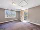 Spacious room with carpet, a window, and a door leading outside at 927 Dean Patrick Rd, Locust Grove, GA 30248