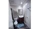 Cozy bathroom with a wooden cabinet sink and a blue pattern rug at 796 Glynn Oaks Dr, Clarkston, GA 30021
