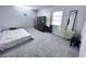 Bright bedroom with carpet, a black wardrobe, and a bright window for natural light at 796 Glynn Oaks Dr, Clarkston, GA 30021