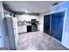 Functional kitchen featuring white cabinets, stainless steel appliances, and a sliding glass door at 796 Glynn Oaks Dr, Clarkston, GA 30021