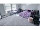 Bright bedroom featuring carpet, an air conditioner, and ample natural light at 796 Glynn Oaks Dr, Clarkston, GA 30021